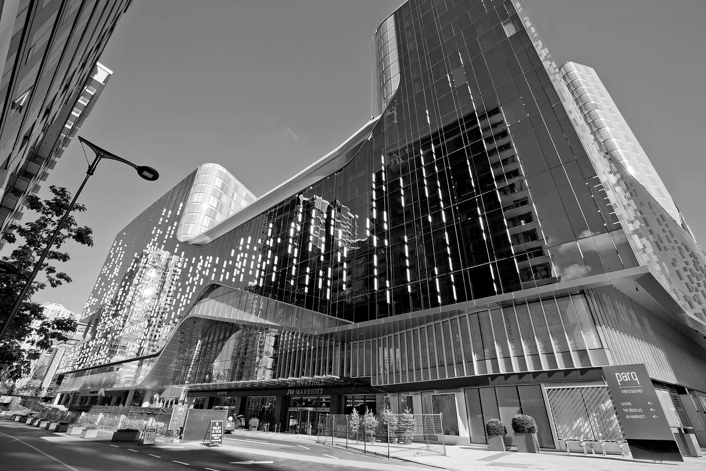 The copper-glass Parq Vancouver building seen from the street